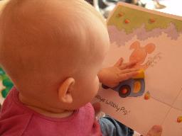 reading one of her favourite flap books